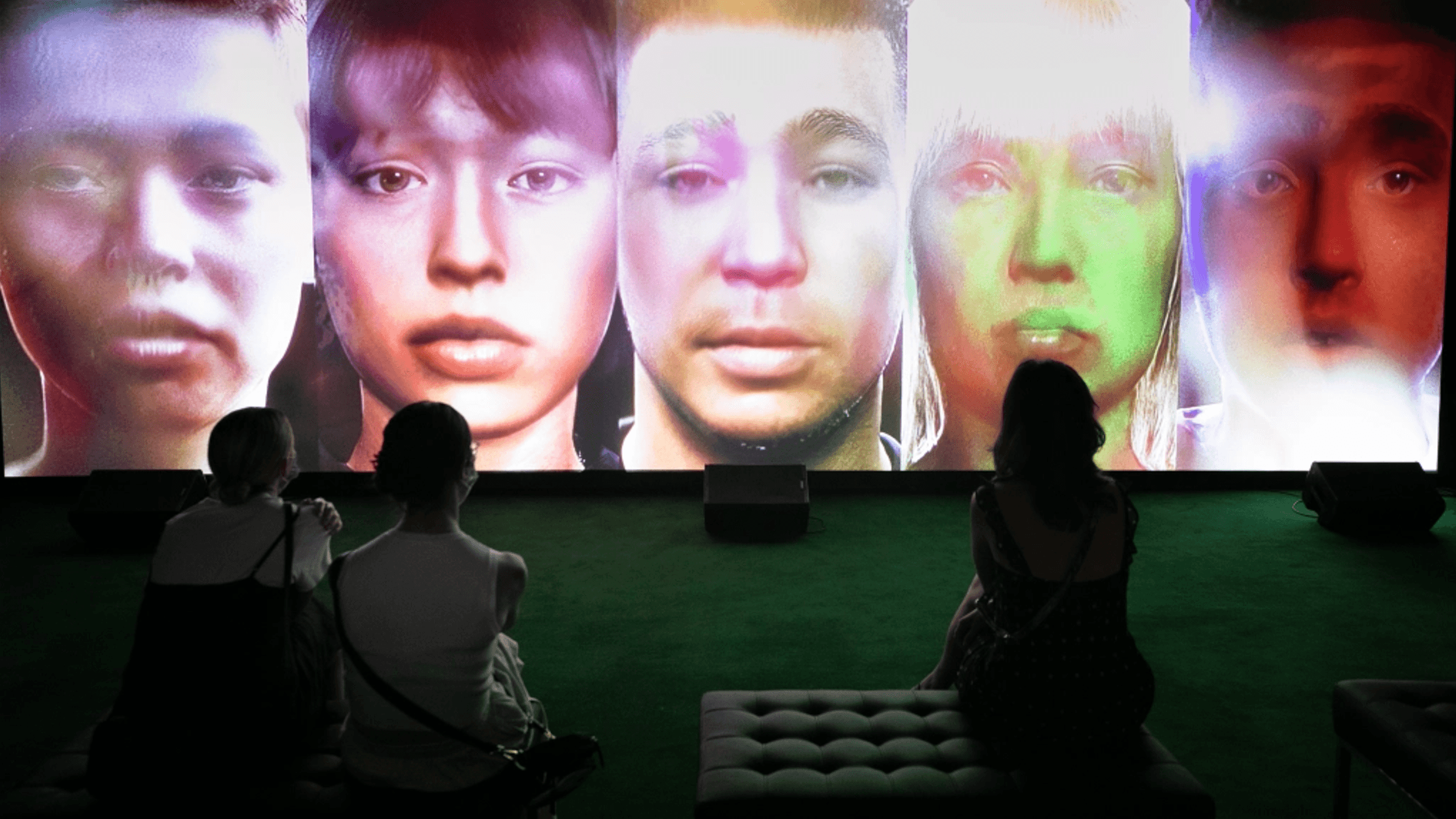 Visitors watching 'Songs to Experience' Exhibition