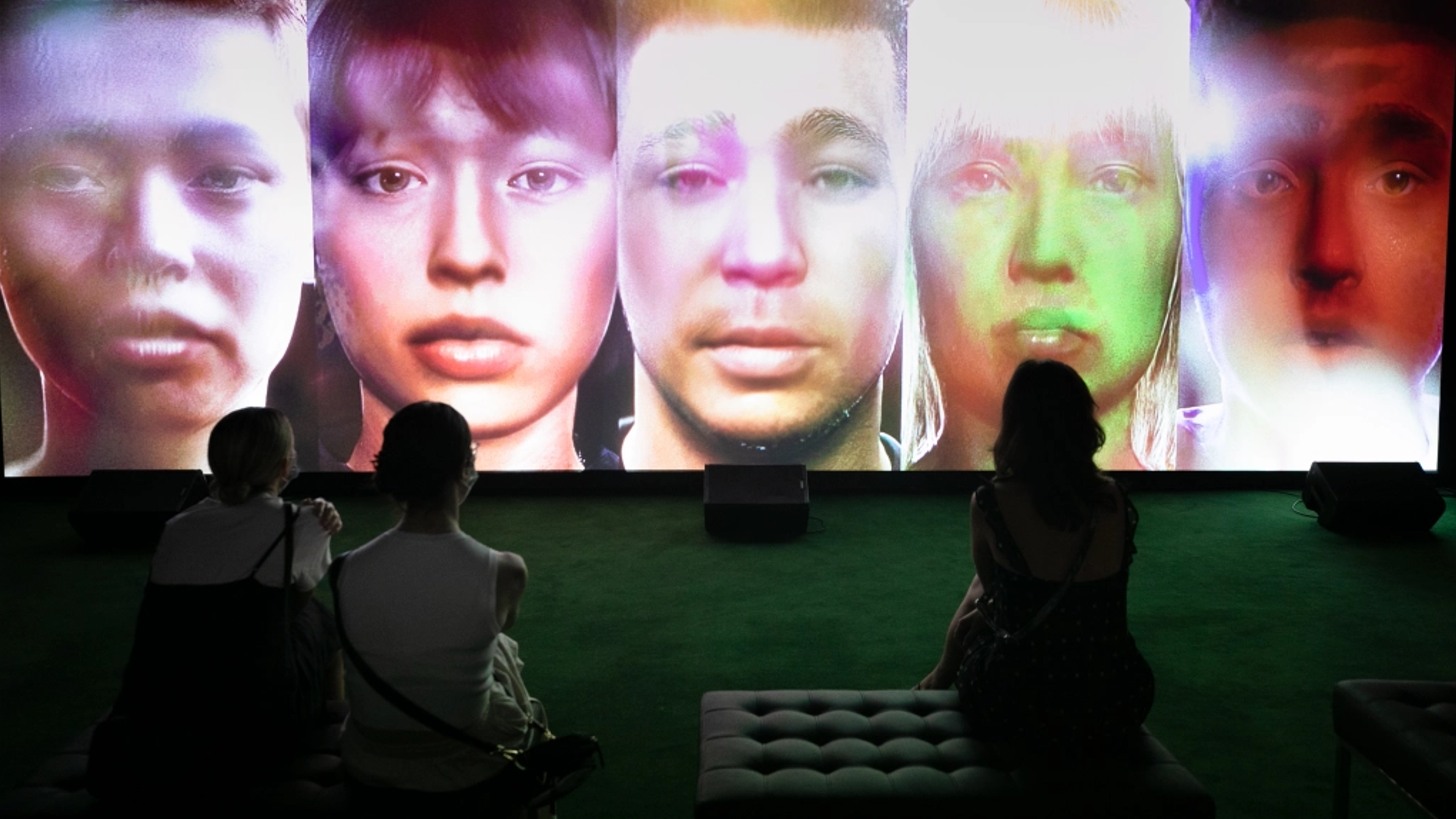 Visitors watching 'Songs to Experience' Exhibition