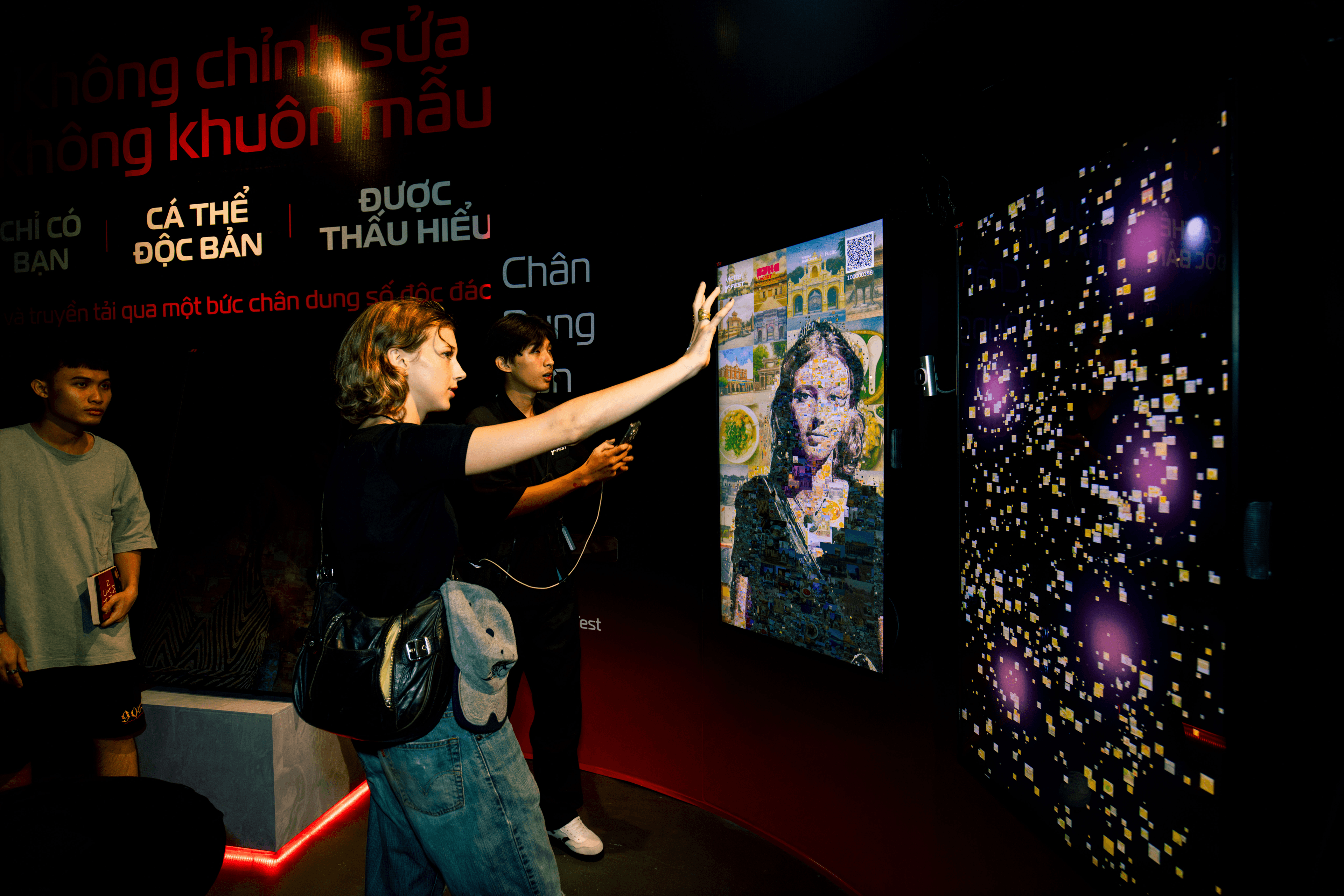 Visitors experiencing their own Mosaic portrait in the interactive space
